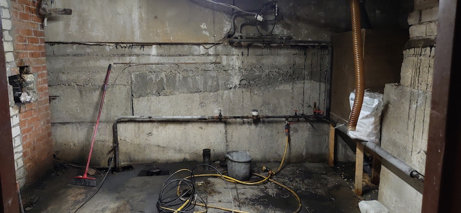 A properly functioning sump pump in a basement, preventing flooding and water damage